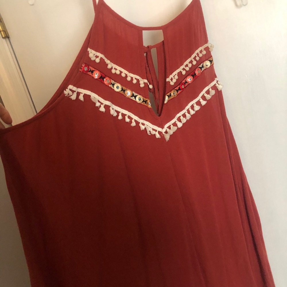 Terracotta red-orange blouse with tassels